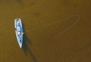 fly fishing from a fishing kayak arial view