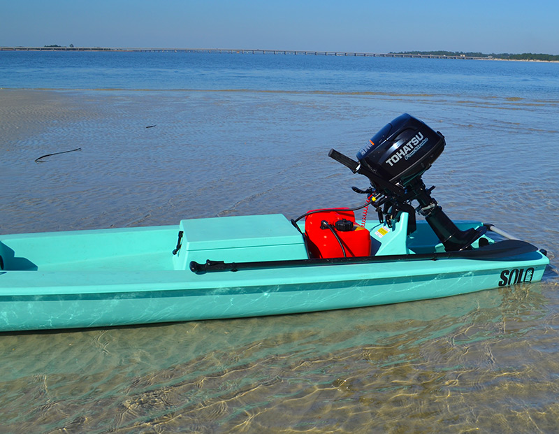 SUP paddle on side of the solo skiff kayak