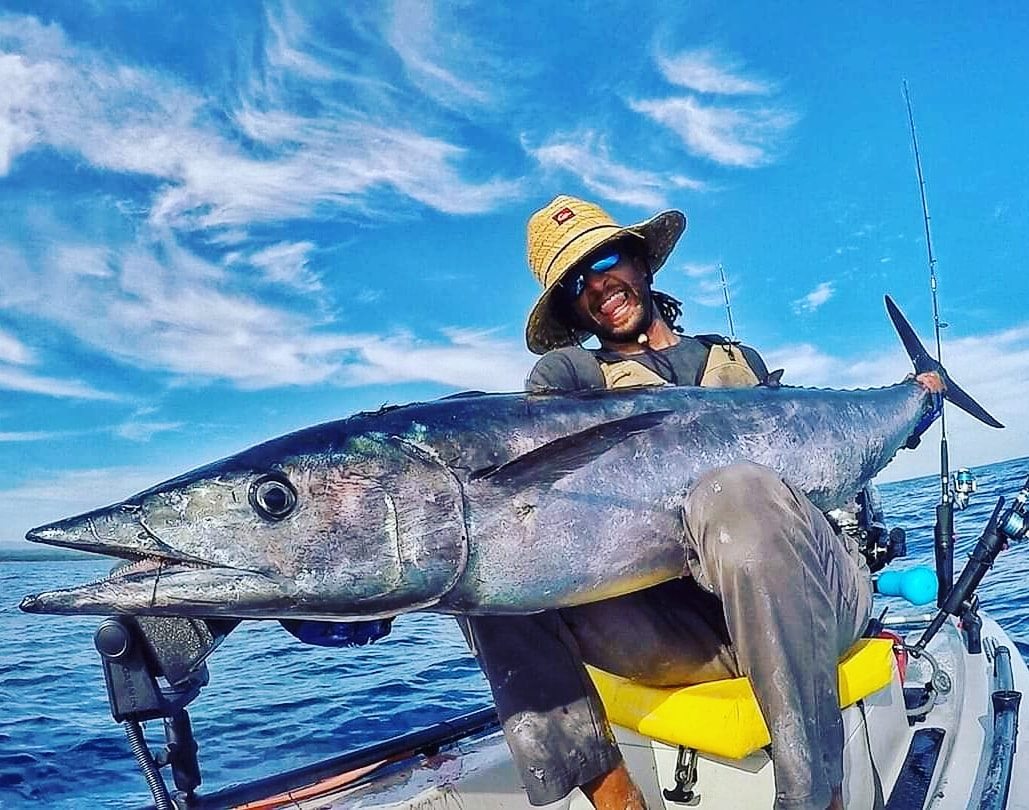 A giant wahoo on a motorized kayak