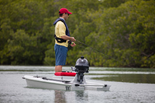 standing in a solo kayak